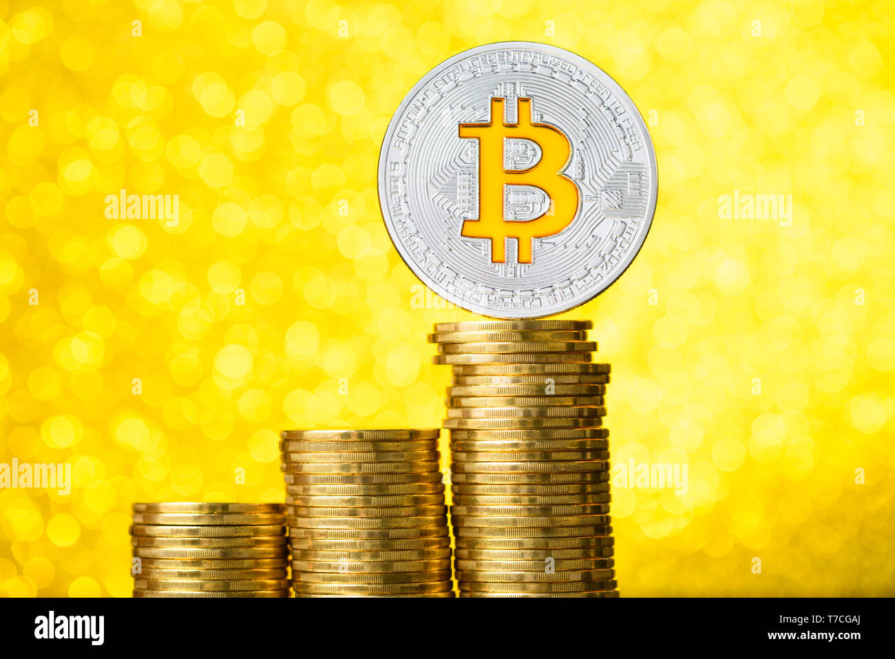 Bitcoin cryptocurrency gold coin. Rise and fall charts of bitcoin Stock  Photo - Alamy