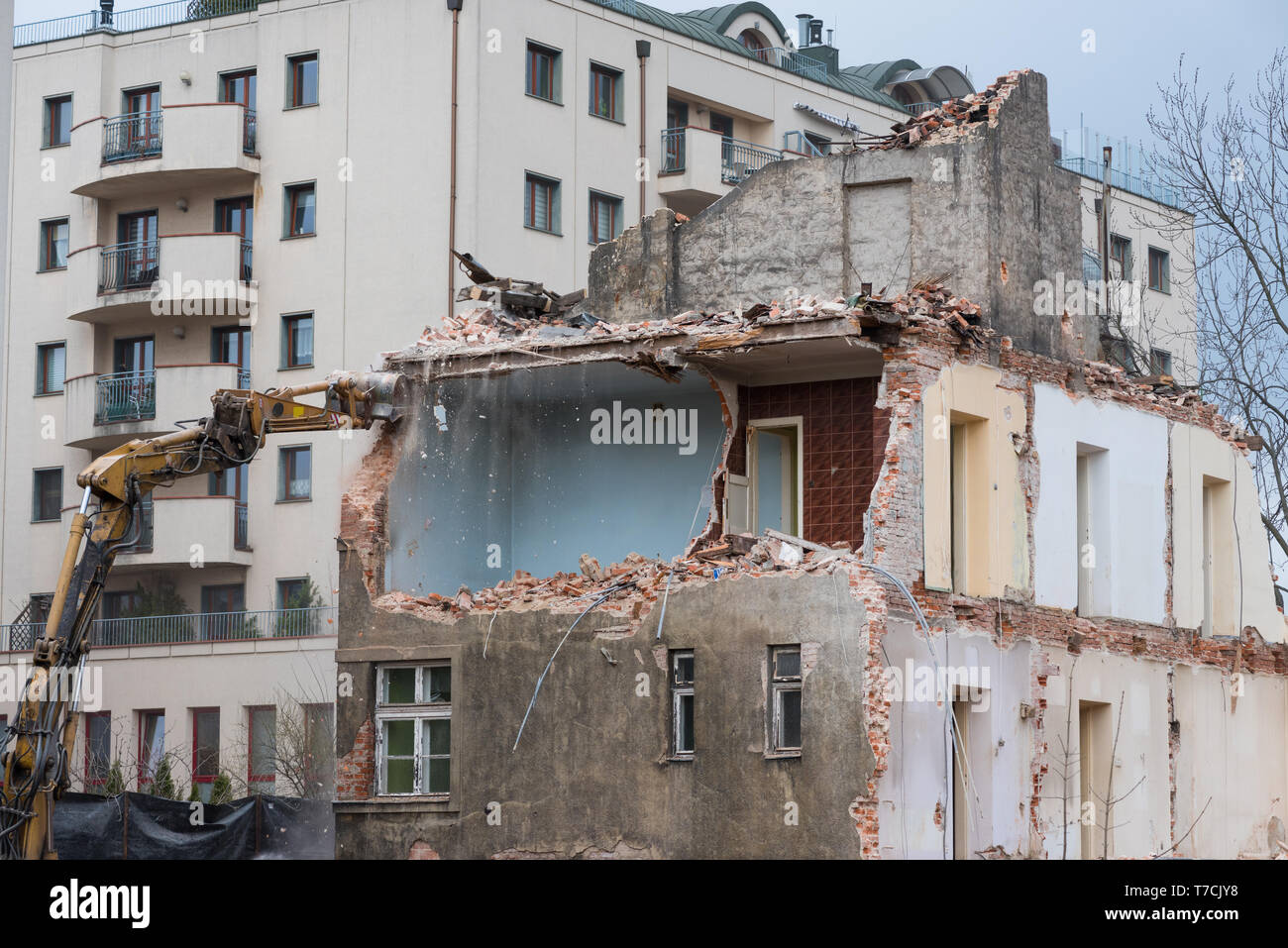 Residential building demolition with excavator Stock Photo Alamy