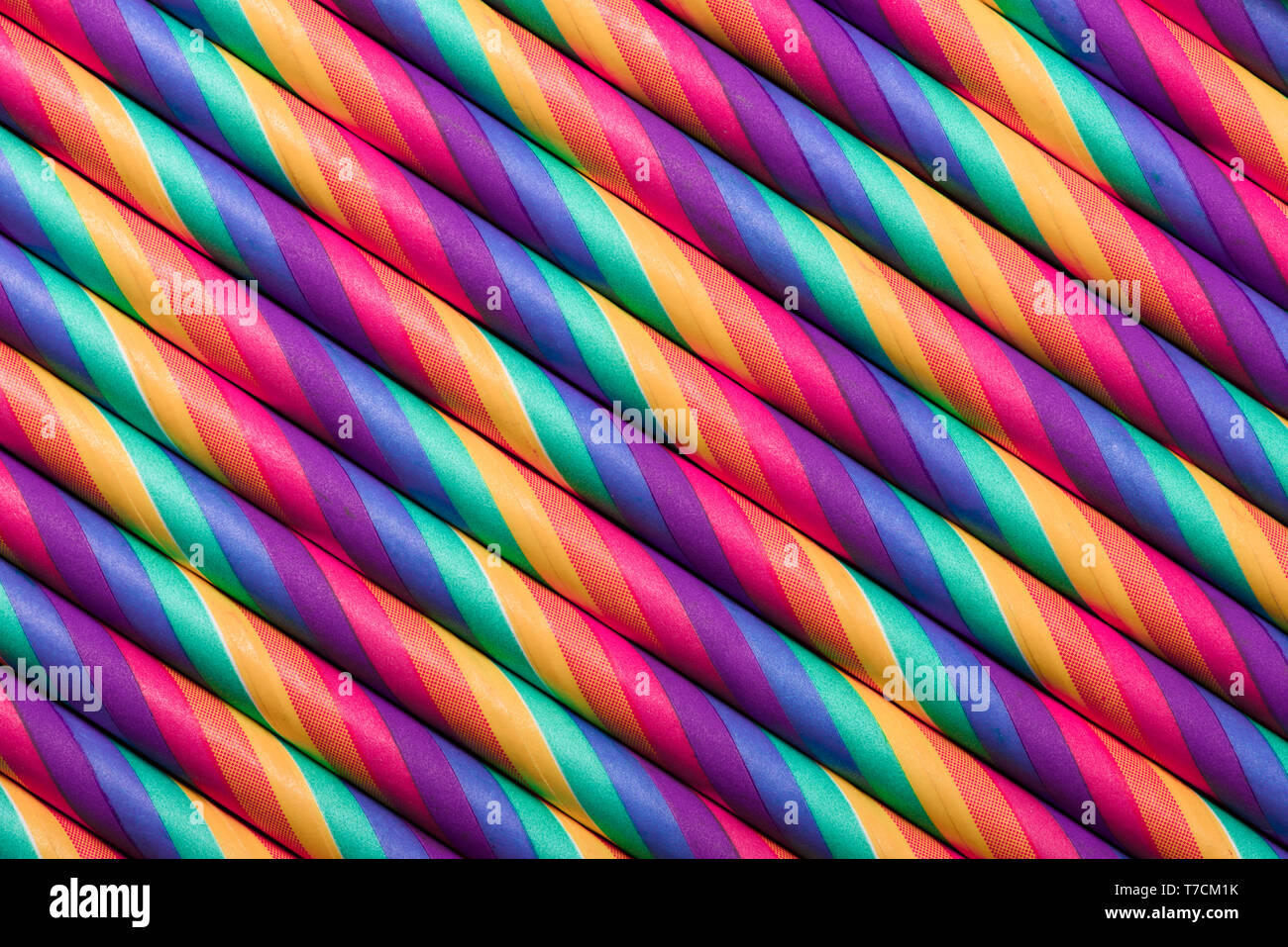 Retro psychedelic rainbow multicolored straws row abstract background Stock Photo