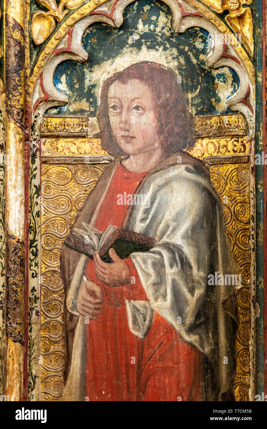 Medieval paintings of saints on rood screen inside church of Saint