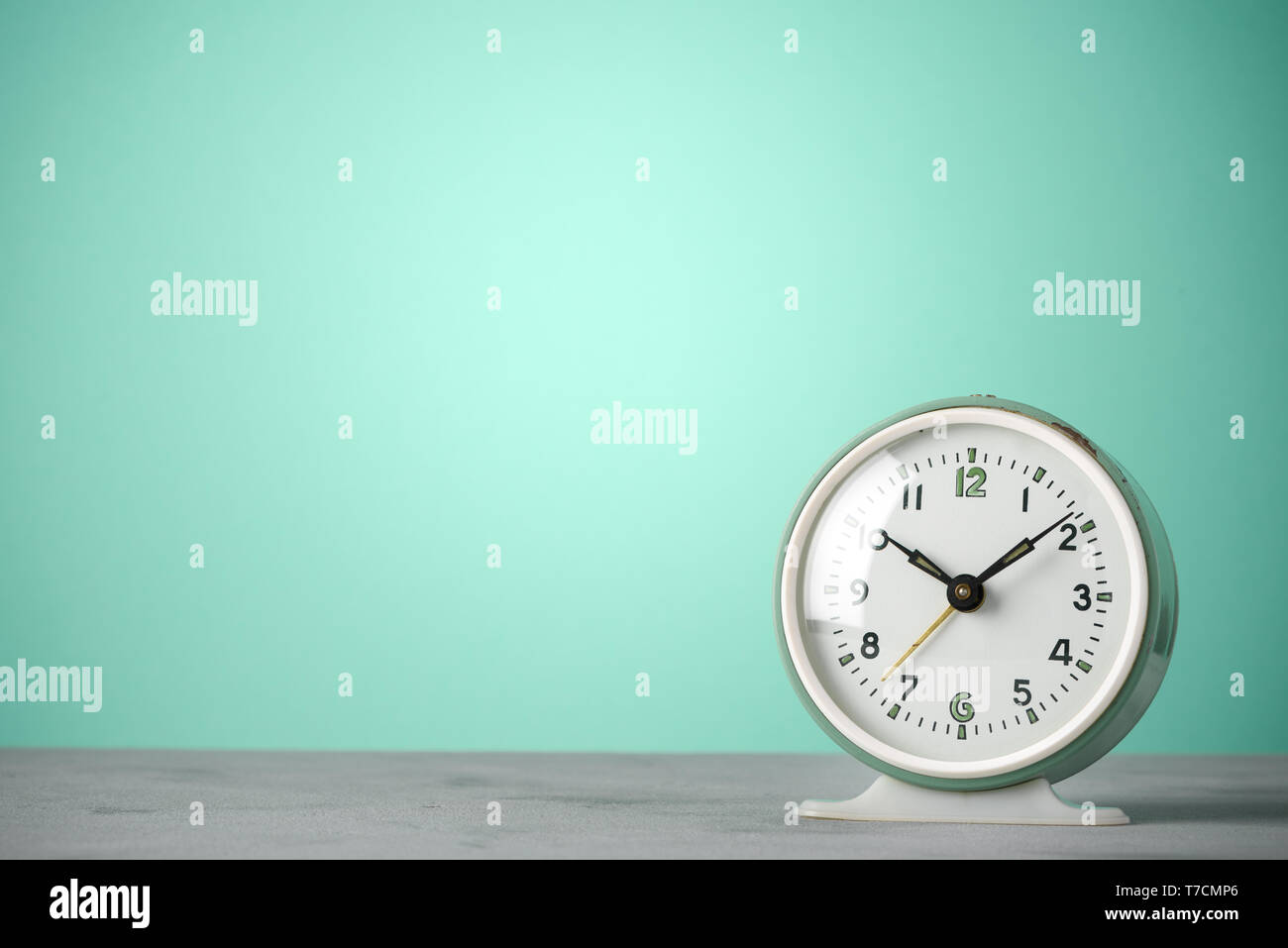 Retro old classic round alarm clock vintage color background with copy space Stock Photo