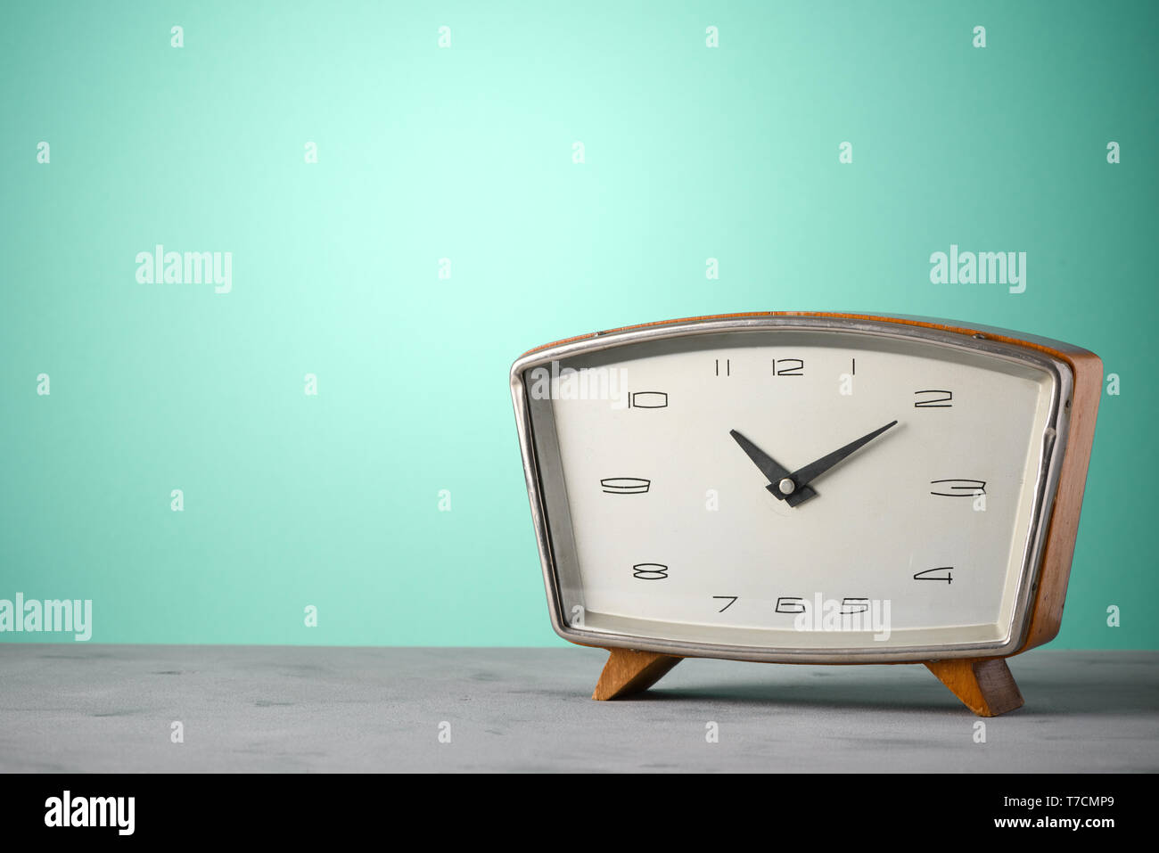 Retro classic wooden alarm clock vintage color background with copy space Stock Photo