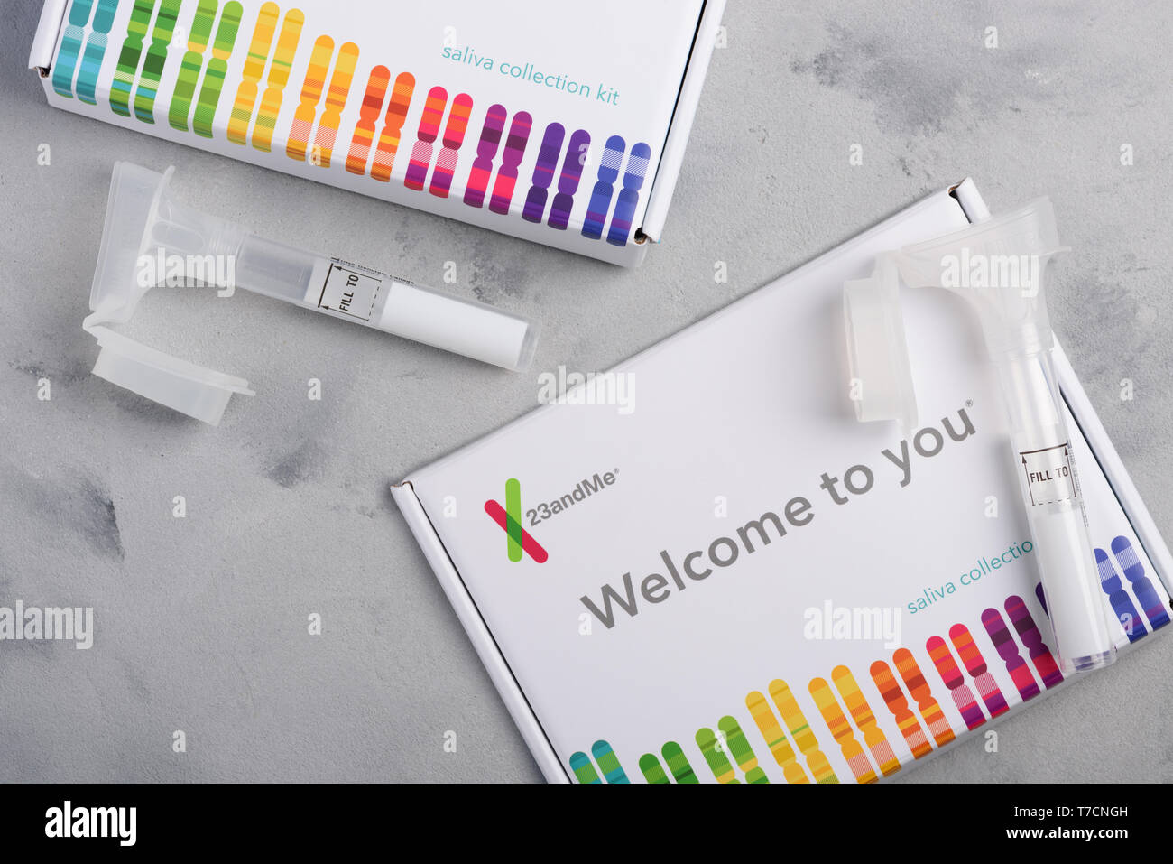 Kiev, Ukraine - 17 October 2018: 23andMe personal genetic test saliva collection kit, with tube and box on table overhead view. Illustrative editorial Stock Photo