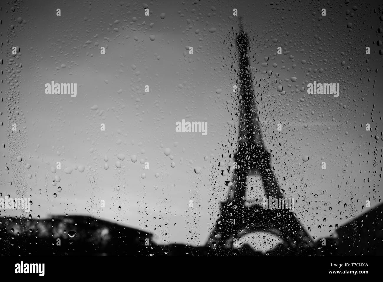 Paris Eiffel Tower through window at rainy weather Stock Photo