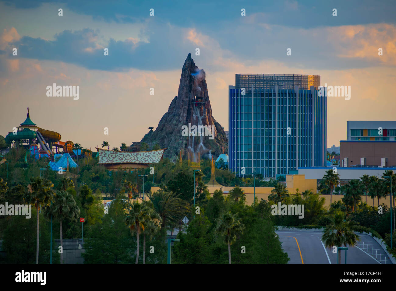Orlando, Florida. April 18, 2019. Beautiful view of Volcano Bay water park and Aventura Hotel on sunset background at Universal Studios area. Stock Photo