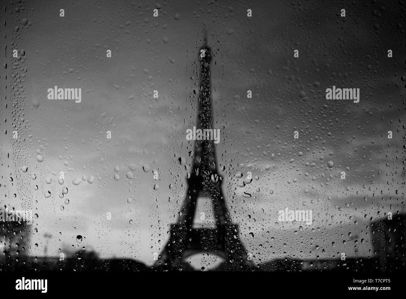 Paris Eiffel Tower through window at rainy day Stock Photo