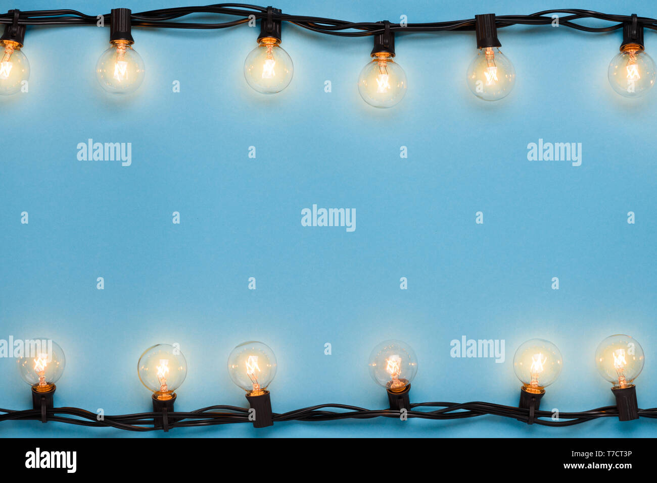 Garlands of lamps warm light edison lights on blue background with ...