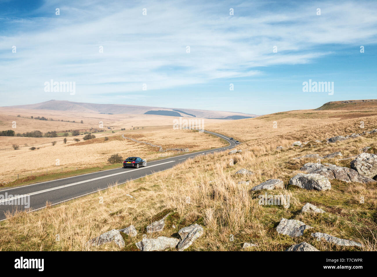 Cars on asphalt road across scenic hills of Brecon Beacons in Wales, UK Stock Photo