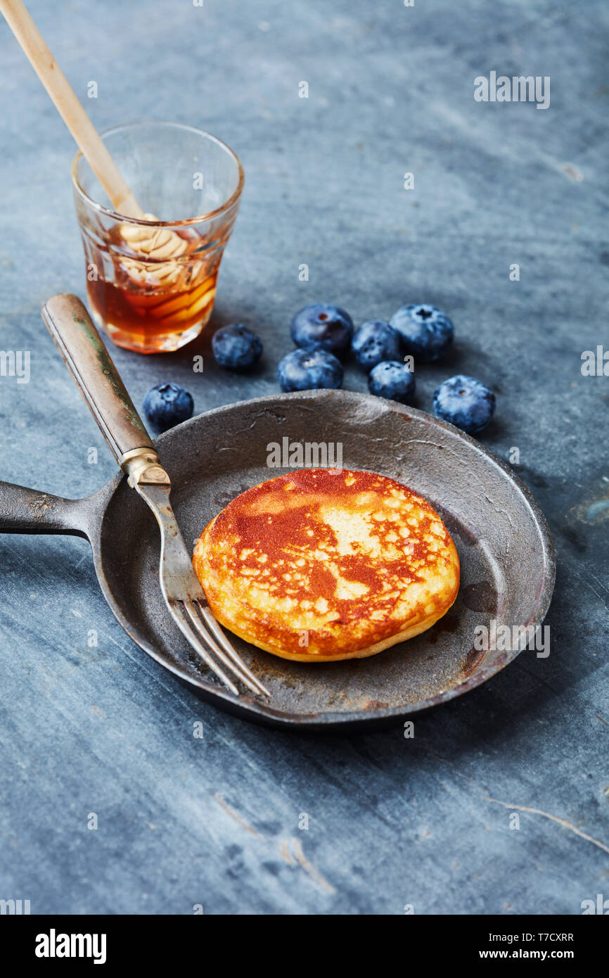 Fresh brunch pancakes with berries and honey Stock Photo