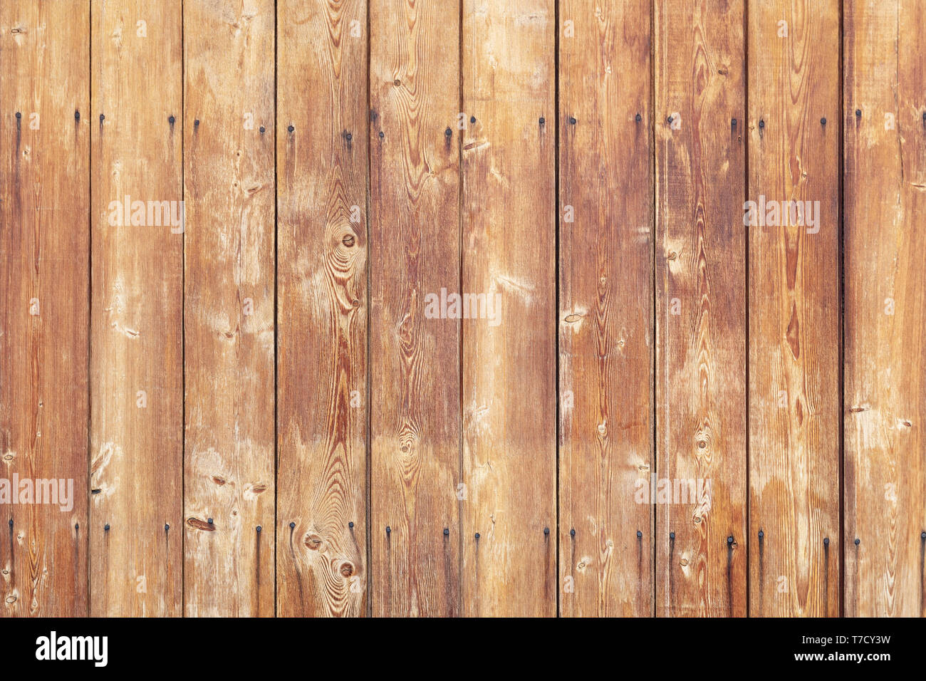 Background from old boards with nails arrival, vertical orientation. Stock Photo