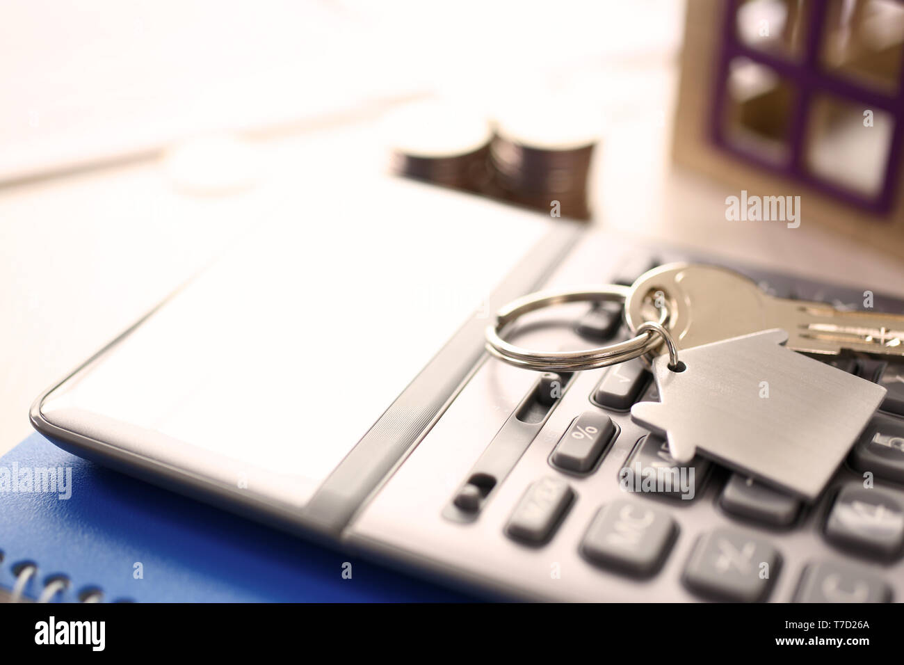 Calculator on Notepad, Key with Trinkel Desktop Stock Photo