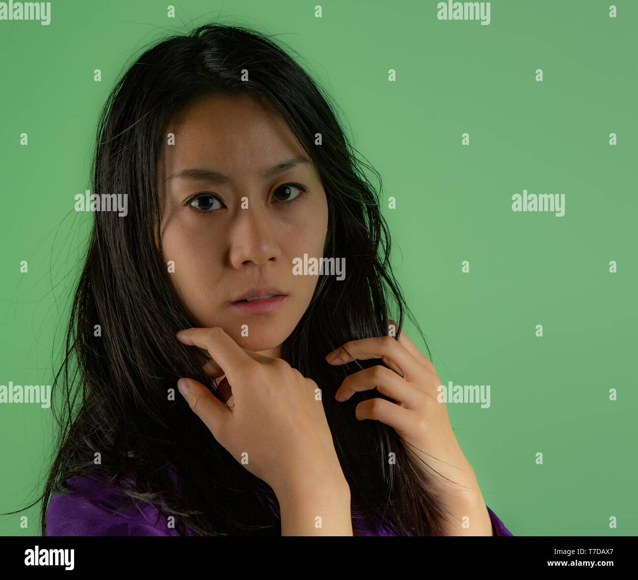 Japanese woman head and shoulders image. Wearing a purple kimono