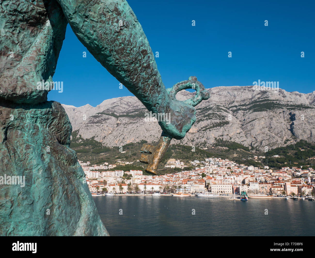 Key in hand of Saint Peter monument in Makarska on sunny day Stock Photo