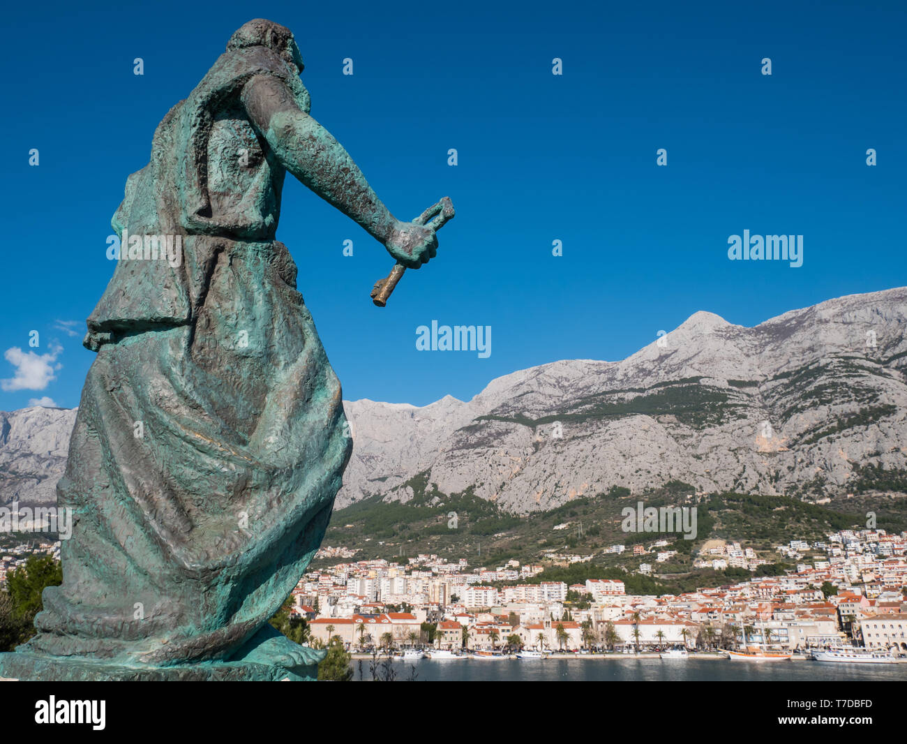 Editorial - Statue of Saint Peter with key in front of city Makarska in Croatia on sunny summer day Stock Photo