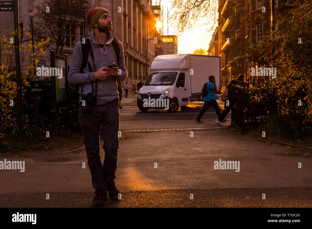 A Photographer Walks Through Victoria Tower Gardens, Westminster, London, UK Stock Photo