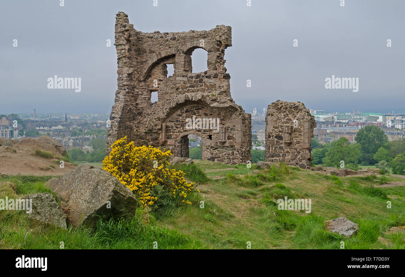 Saint Anthony's Chapel Ruins at Holyrood Park with view across Edinburgh, Scotland behind. Stock Photo