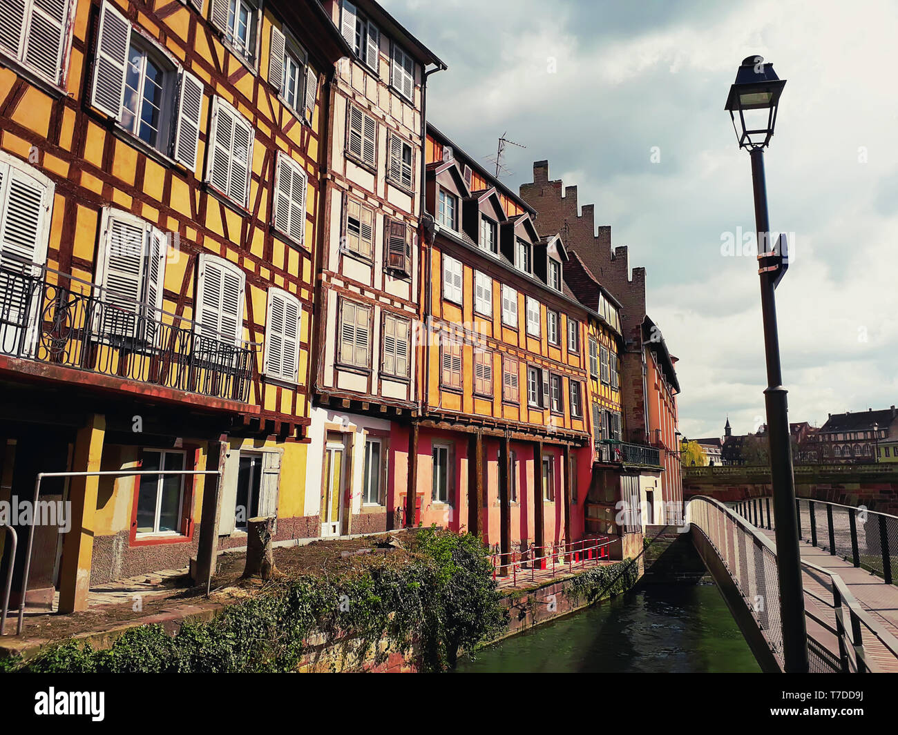 Colorful romantic city Strasbourg, France, Alsace. Traditional houses near the river. Medieval home facade, historic town. Beautiful idyllic architect Stock Photo