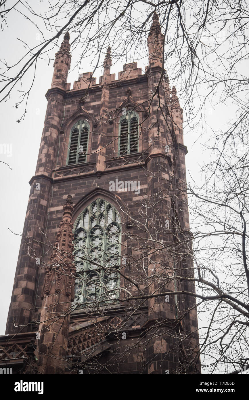 Old religious tower in the streets of Manhattan in New York Stock Photo