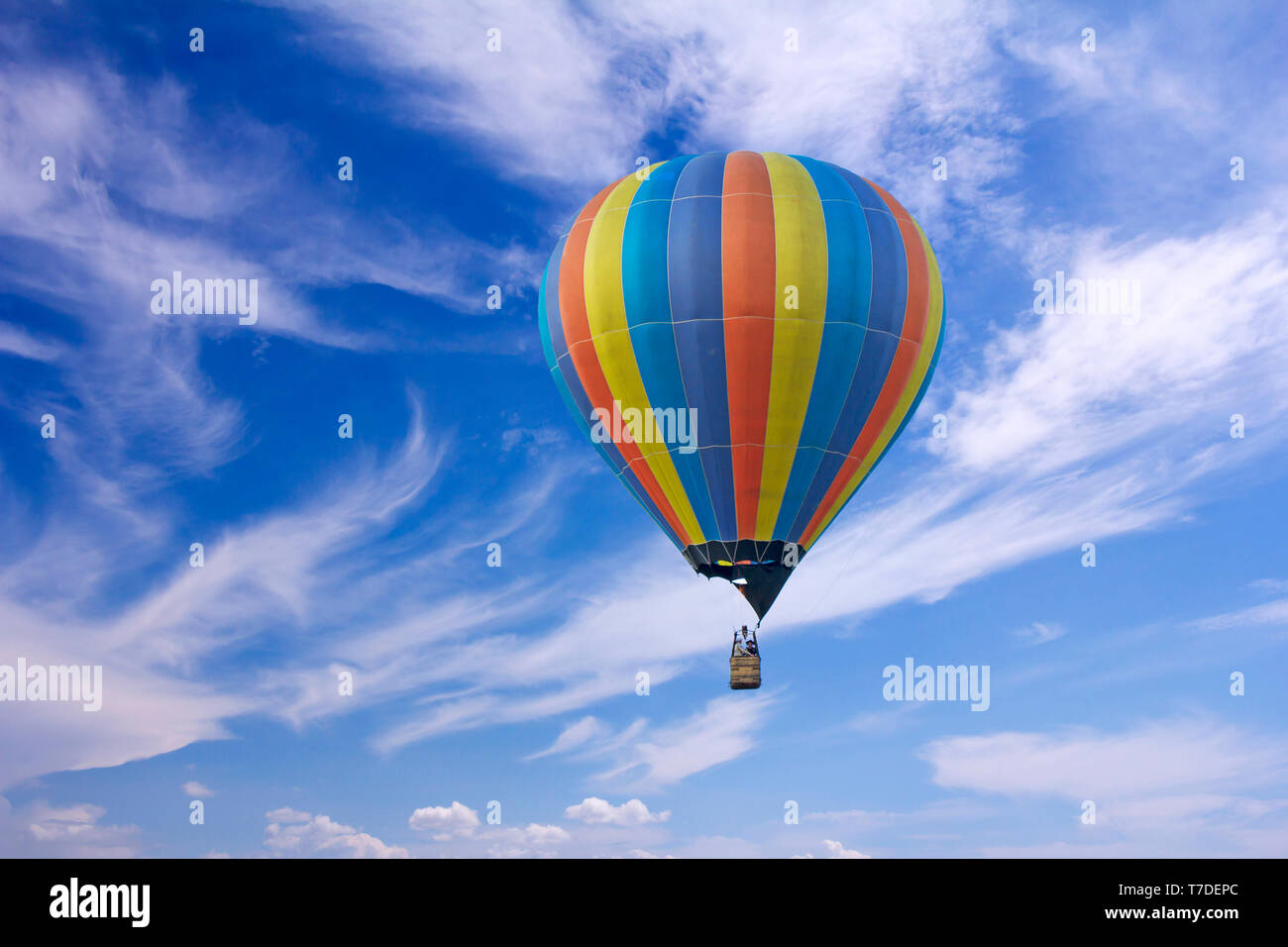Colorful hot-air balloon flying in the blue sky Stock Photo - Alamy