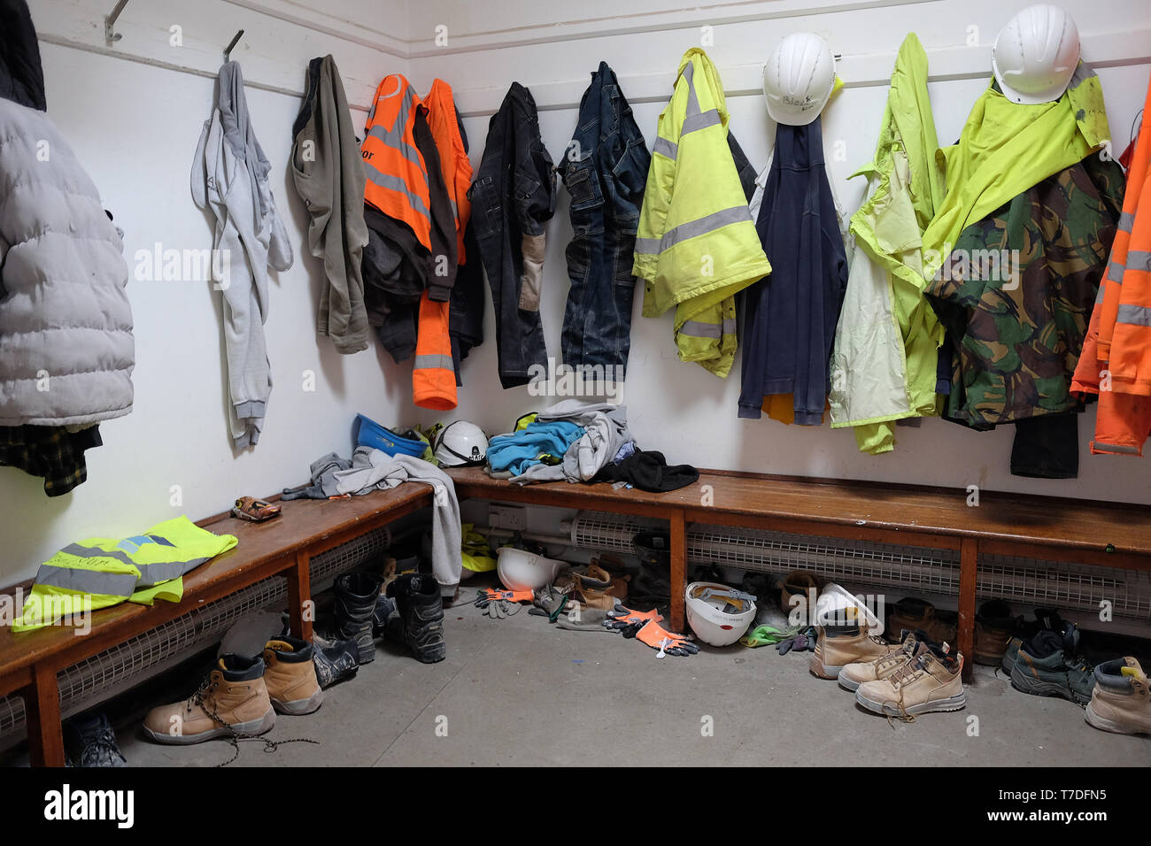 May 2019 - Construction site workers changing and mess room with hanging coats Stock Photo