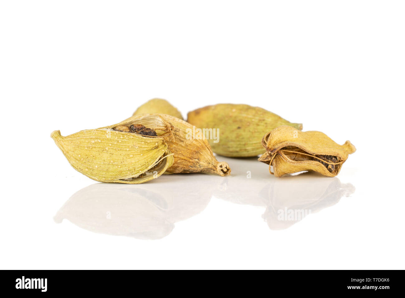 Group of five whole true cardamom pod isolated on white background Stock Photo