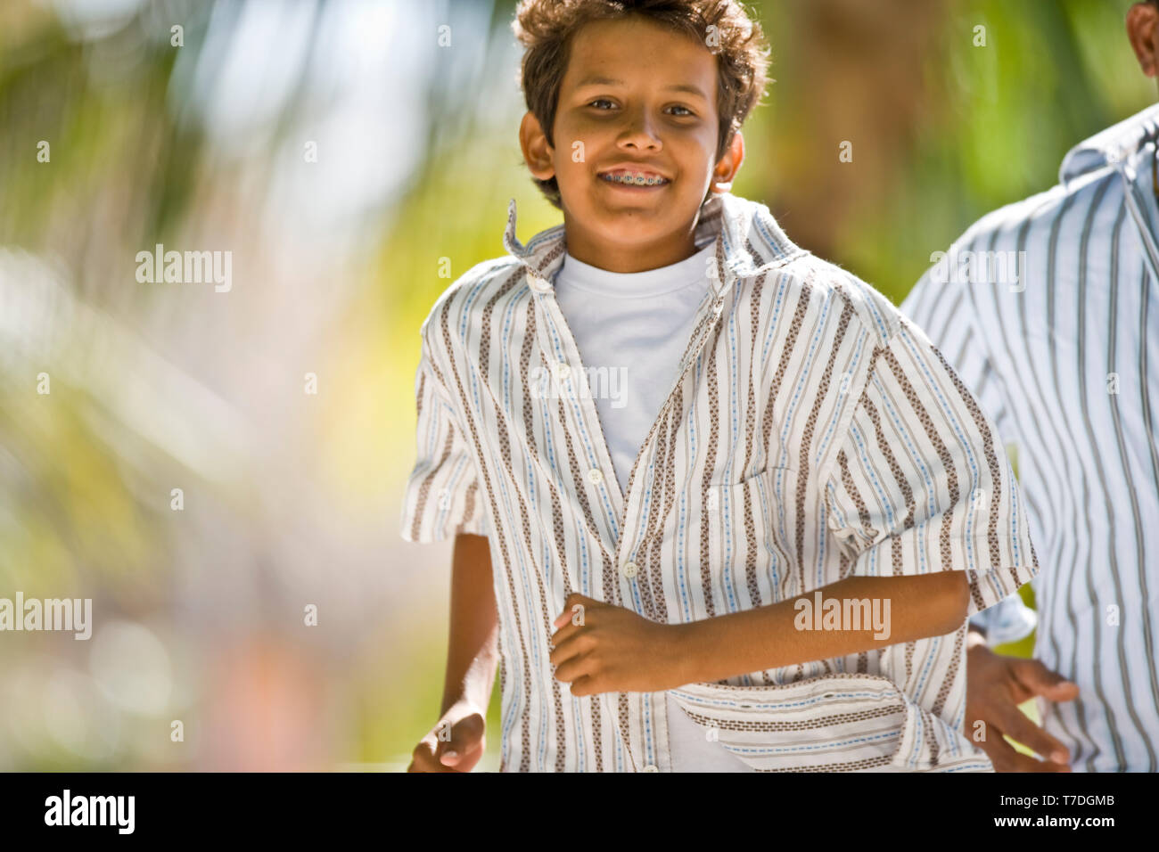 Boy running outside. Stock Photo