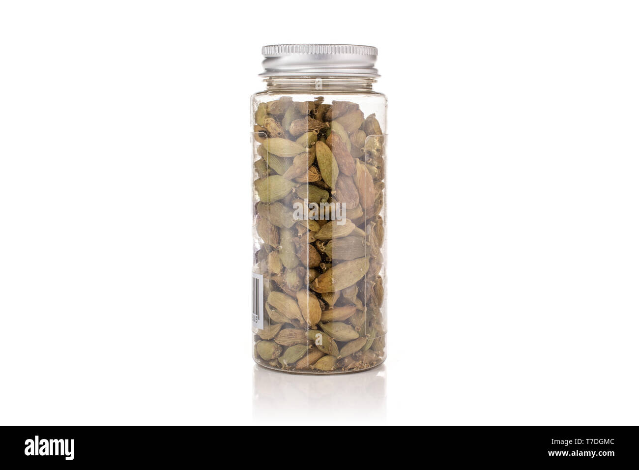 Lot of whole true cardamom pod in a plastic bottle isolated on white background Stock Photo