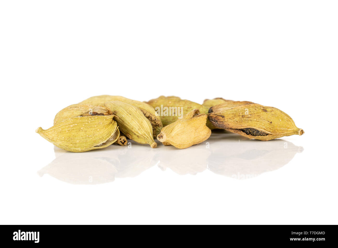 Group of five whole dry true cardamom pod isolated on white background Stock Photo