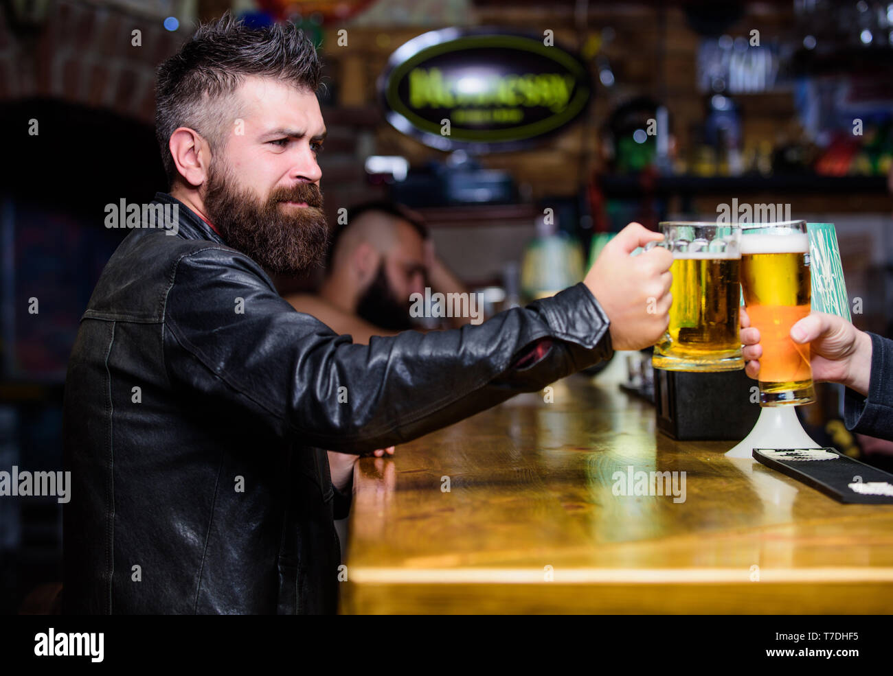 Cheers concept. Glasses with fresh lager draft beer with foam. Men