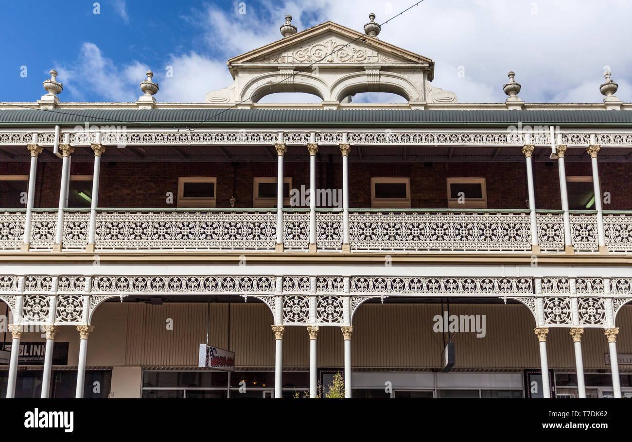 Detail of the heritage listed hotel built in 1889 and ornamented with cast-iron friezework, bullnose awnings and parapets with Grecian urns and pedime Stock Photo