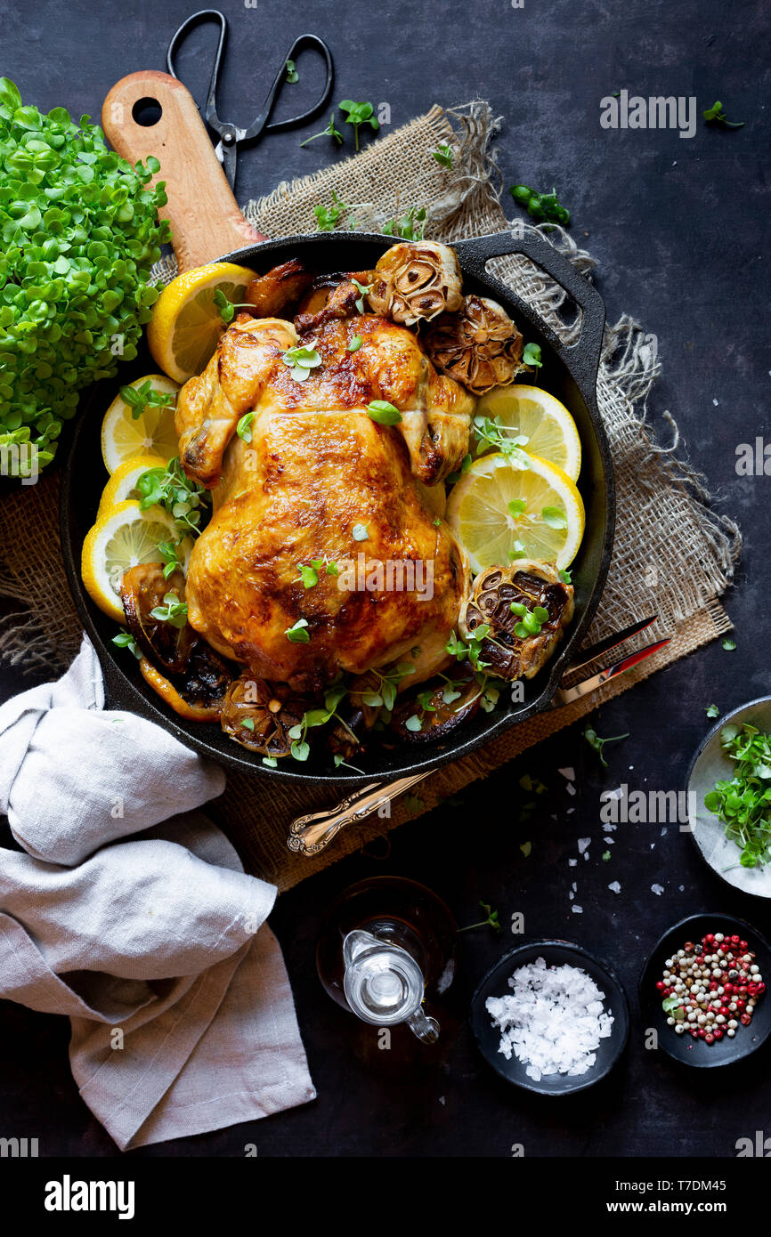 Whole Chicken Roasted in a cast iron pan Stock Photo Alamy