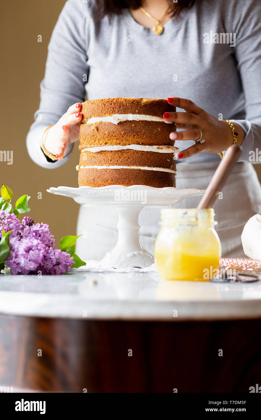 Woman preparing a cake Stock Photo