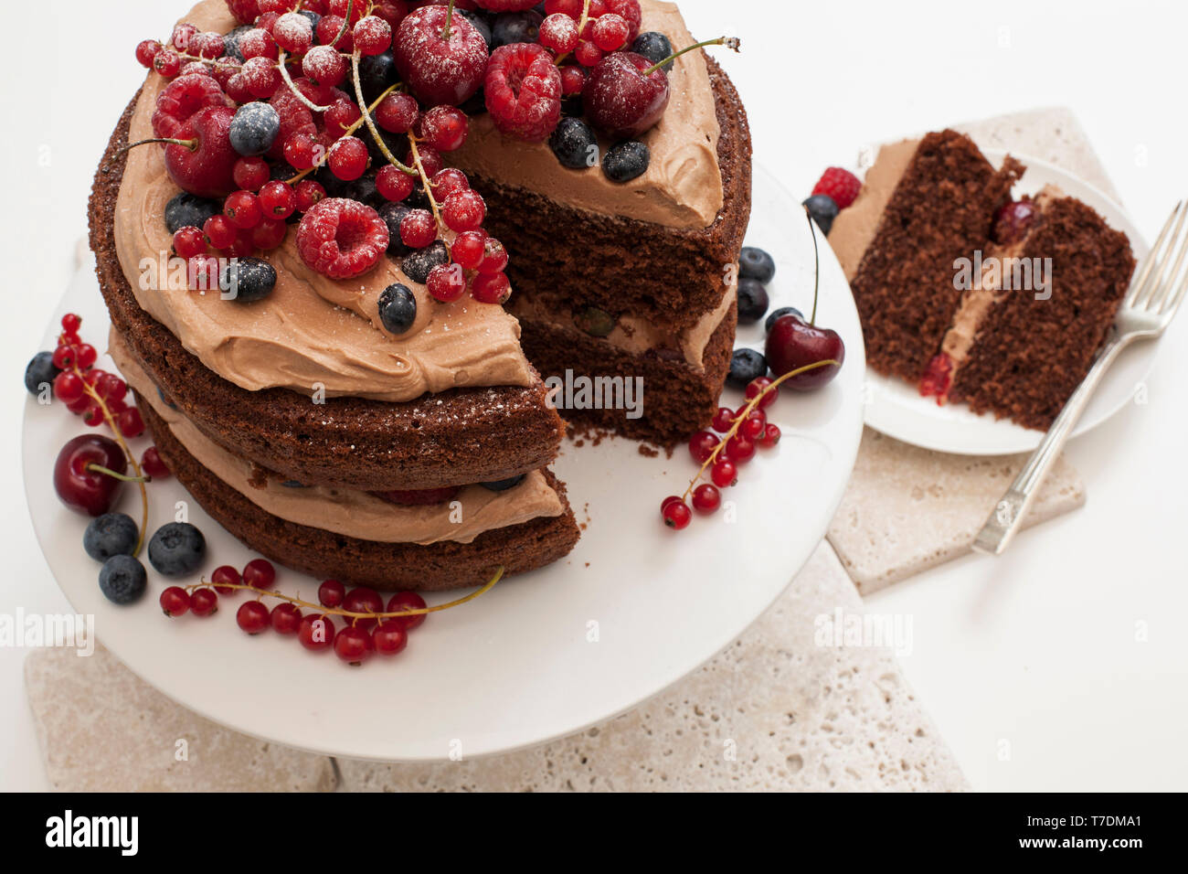 Chocolate layer cake raspberries hi-res stock photography and images ...