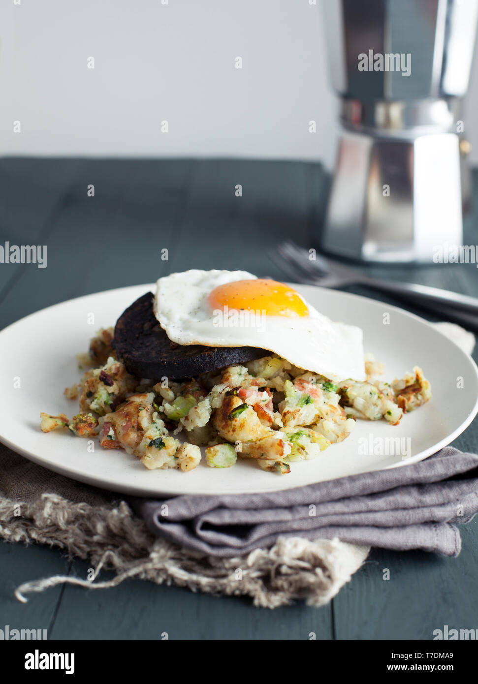 Bubble and Squeak with black pudding and fried egg Stock Photo Alamy