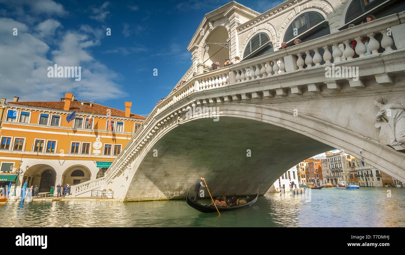 Rialto Bridge and Gondola, Venice, Italy Landmark, faces blurred Stock Photo