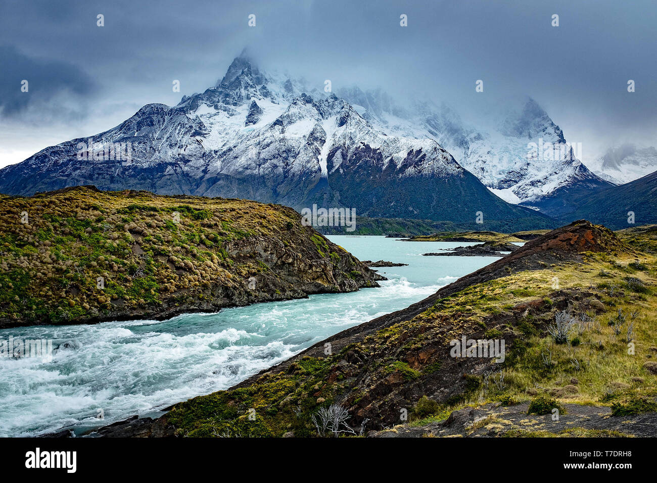 April 2019 Lago Nordenskjold flows into Rio Paine with the stormy Cuernos del Paine in the