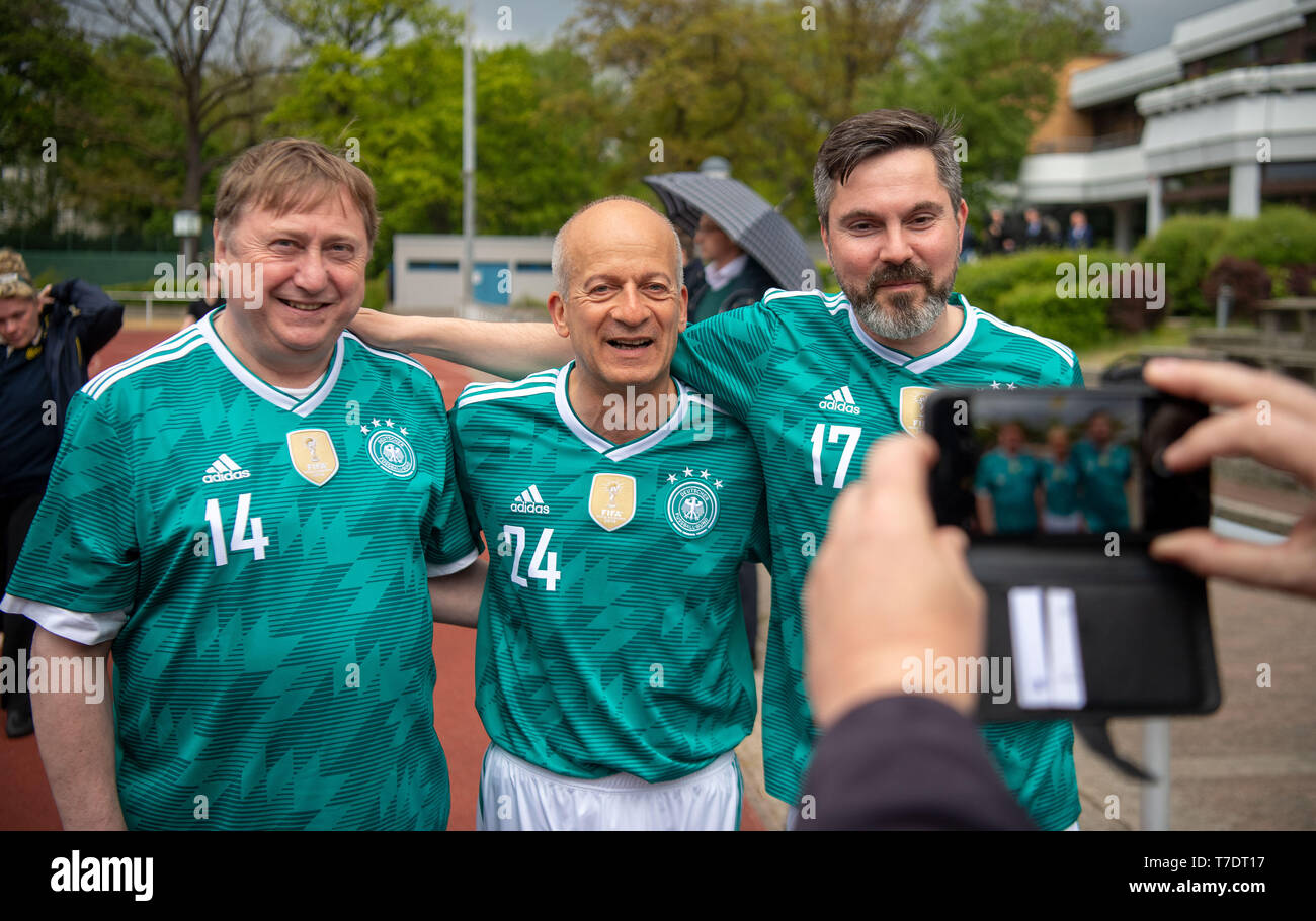 06 May 2019, Berlin: Andre Hahn (l-r, all Die Linke), Friedrich Straetmanns and Fabio De Masi, take a photo before the football match FC Bundestag against the Russian State Duma. The teams meet for the second time. Photo: Monika Skolimowska/dpa-Zentralbild/dpa Stock Photo
