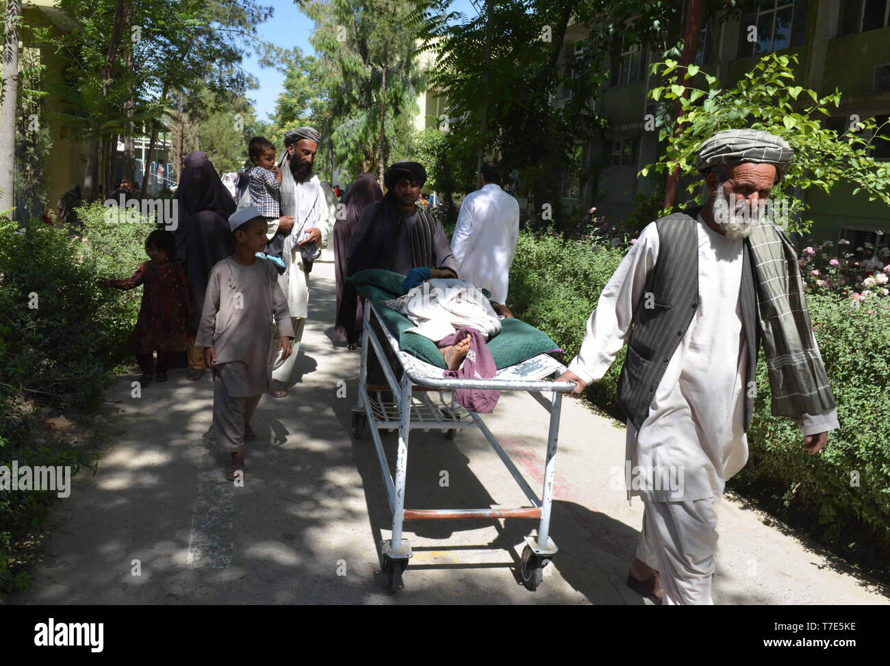 (190507) -- KANDAHAR, May 7, 2019 (Xinhua) -- People carry a man for medical treatment at the Mirwais Regional Hospital in Kandahar, Afghanistan, May 4, 2019. The Mirwais Regional Hospital, locally known as the 'Chinese Hospital', was built by China in 1974 and put into operation in 1979 on 44 acres of land in Kandahar, the largest city in the southern region as a gift to the Afghan people. The hospital is the largest health center in Afghanistan's southern region and provides almost all kinds of services to patients ranging from diagnosis of diseases to surgery of war victims, childcare and m Stock Photo