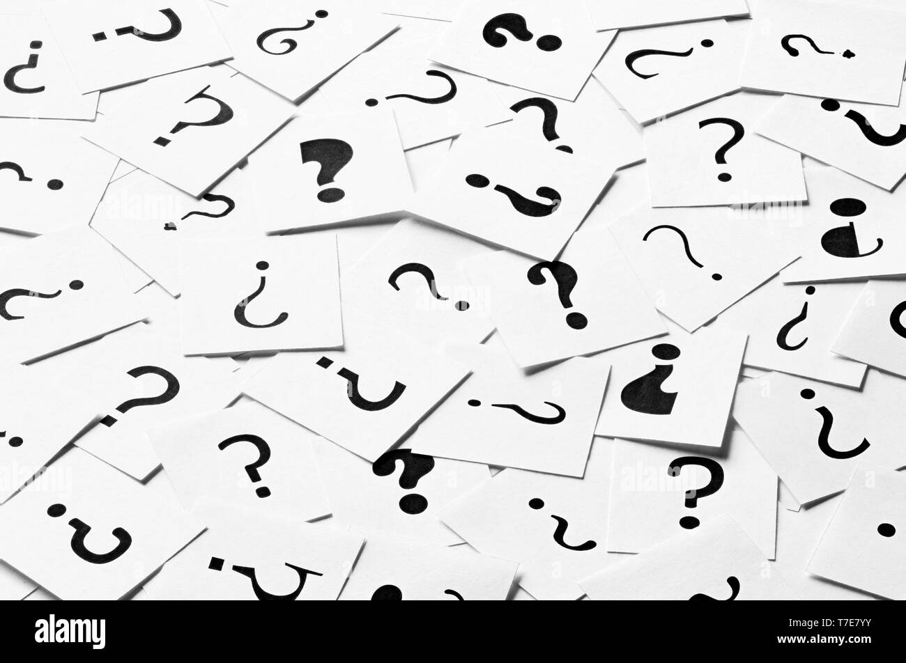 Pile of question mark signs scattered around as a square background. Decision, enquiry or faq concept. Stock Photo