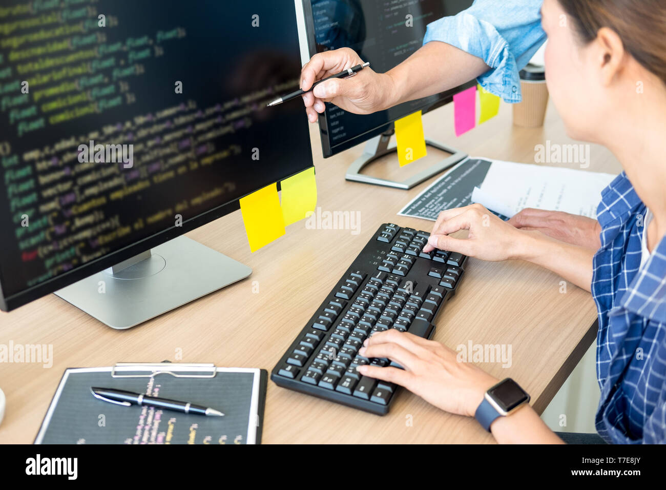 IT office Programmers software development coding technologies On Computer working in a company office. Stock Photo