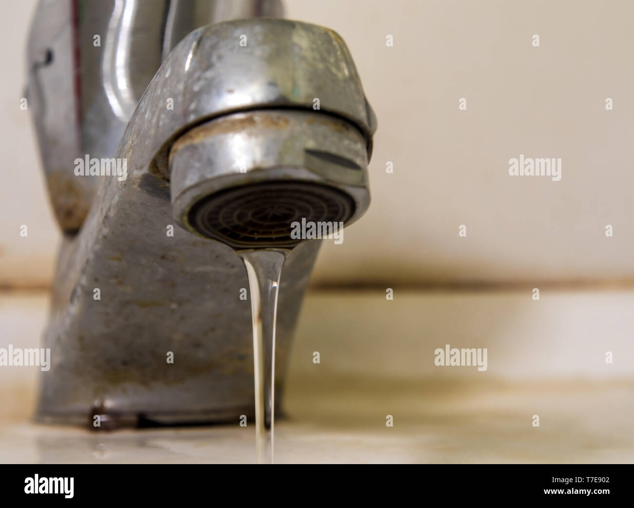 Leaking Water Drops From Old Rust And Stained Faucet Save Water