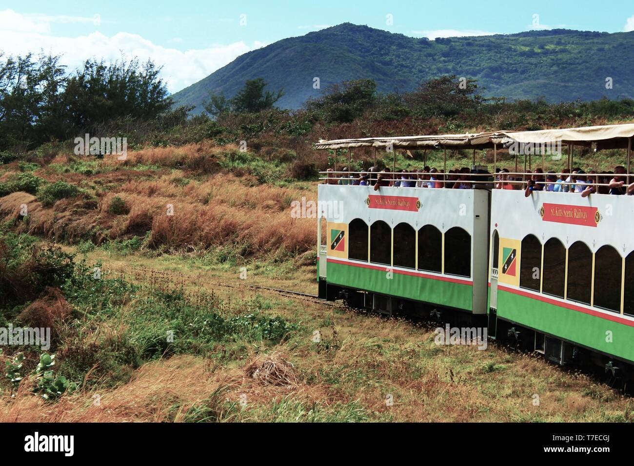 St Kitts, Caribbean - March 1st 2018: The St Kitts Scenic Railway tourist attraction travels through the countryside full of sightseeing tourists. Stock Photo