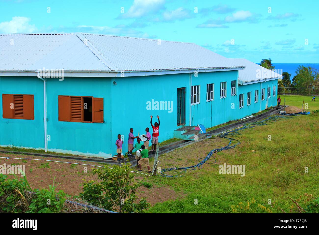 St Kitts, Caribbean - March 1st 2018: A group of children play in the grounds of a school on the Caribbean island of St Kitts. Stock Photo