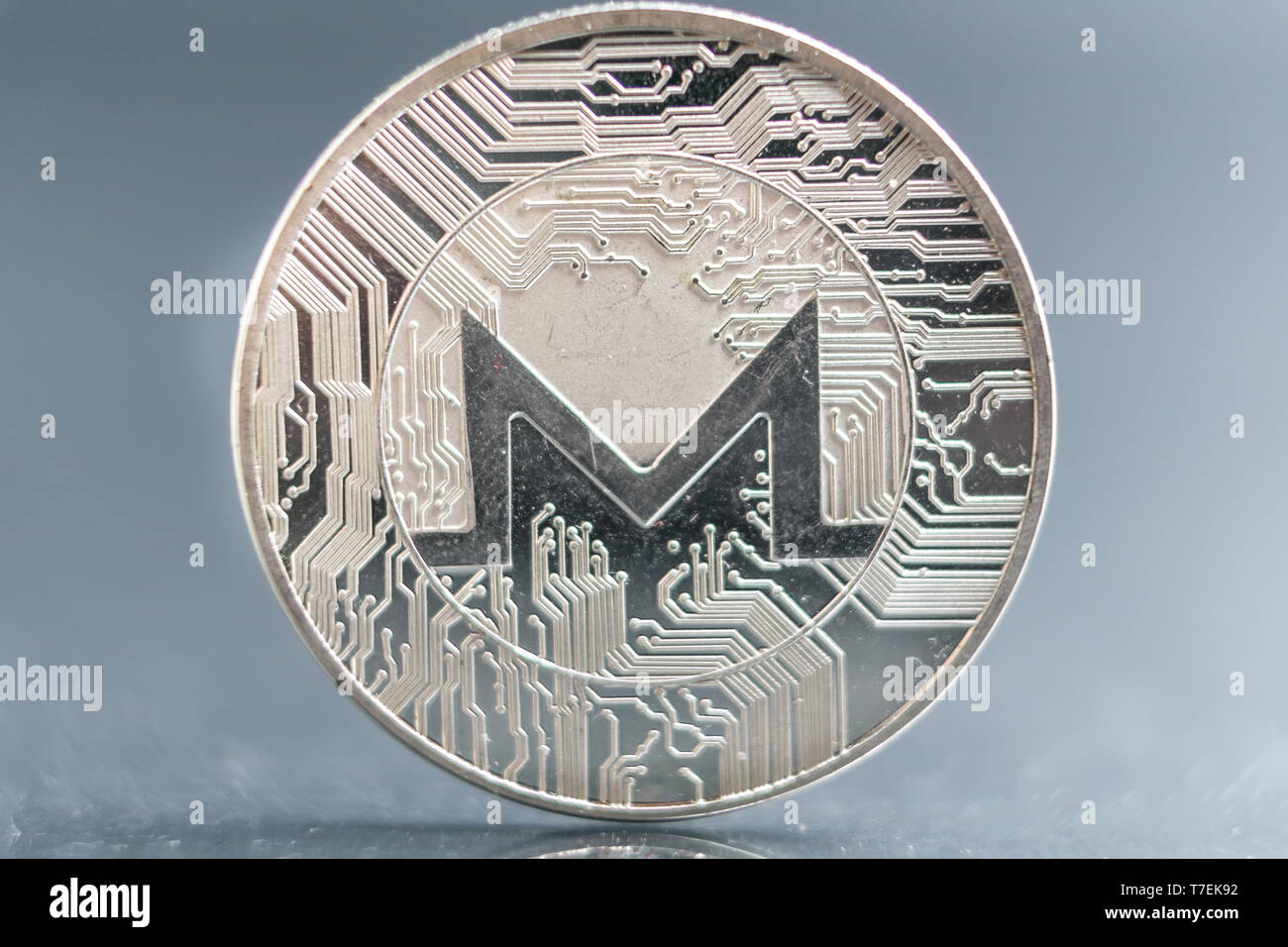 XMR. Monero Crypto currency silver coin, Macro shot of Iota coin isolated  on background, cut out Blockchain technology Stock Photo - Alamy