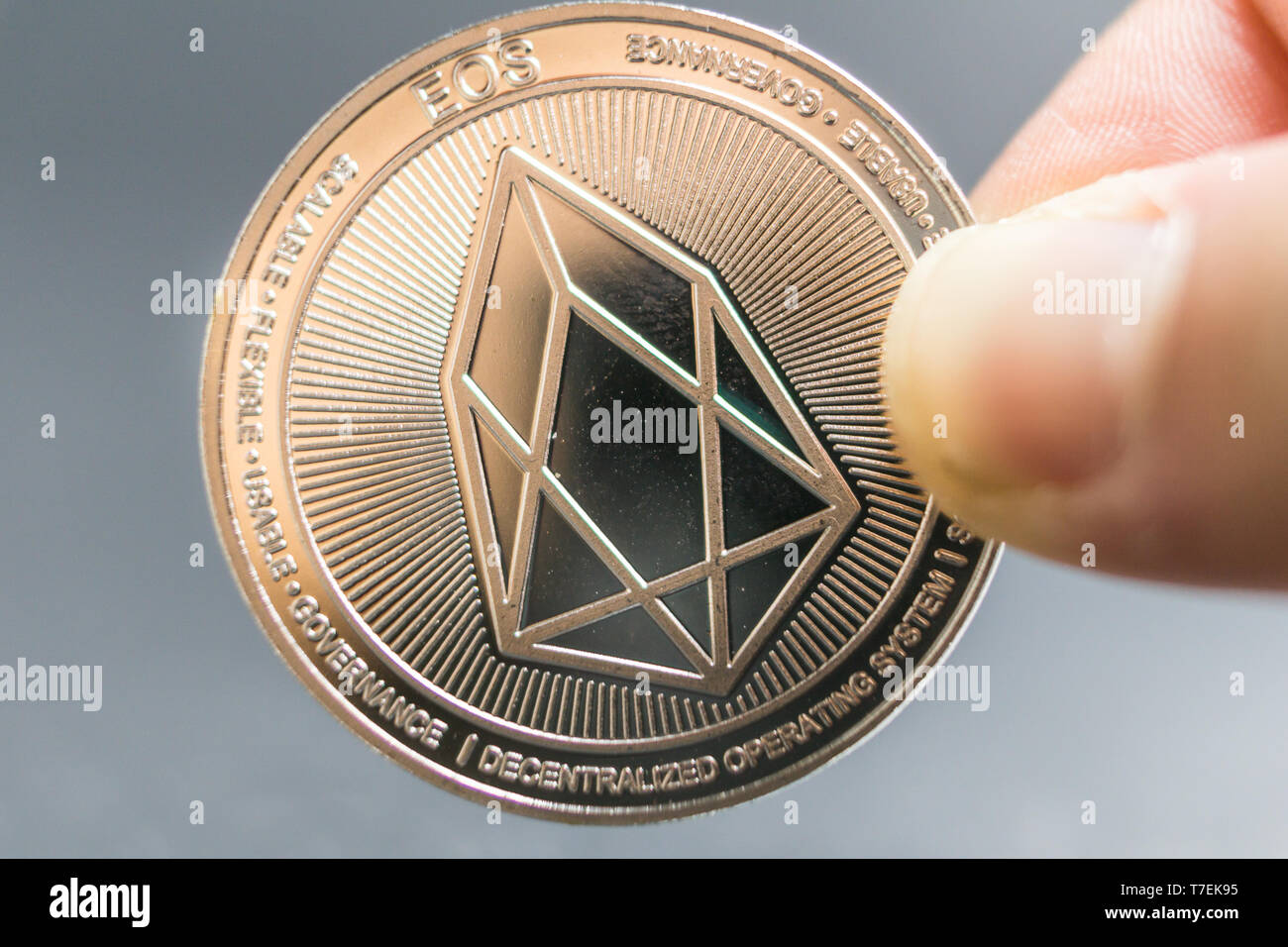 EOS, Crypto currency silver coin, Macro shot of Iota coin isolated on background, cut out Blockchain technology, Stock Photo
