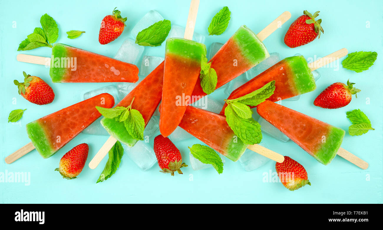 Watermelon flavored summer theme ice cream popsicles on pink and blue background Stock Photo Alamy