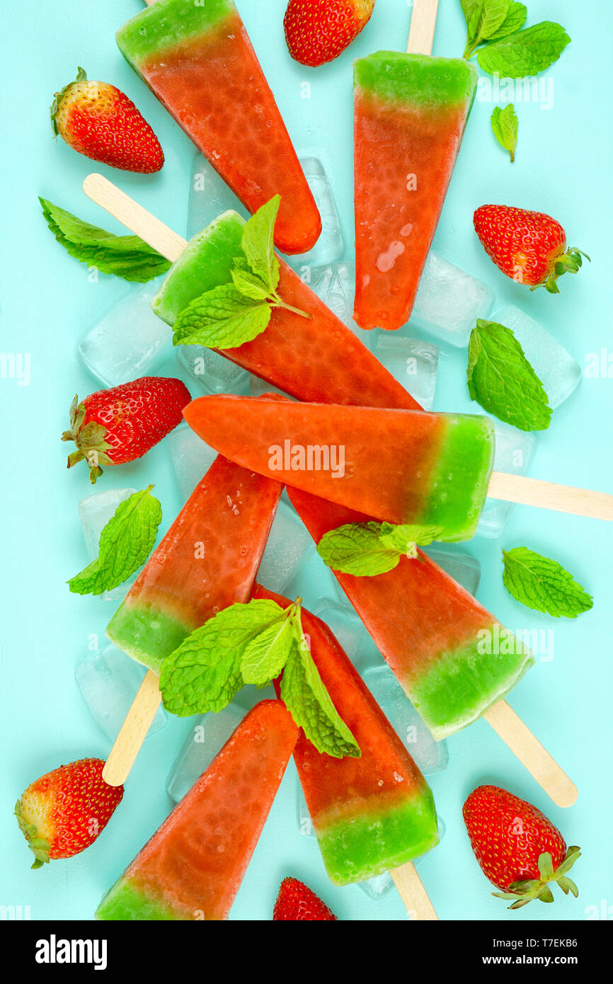 Watermelon flavored summer theme ice cream popsicles on pink and blue background Stock Photo Alamy