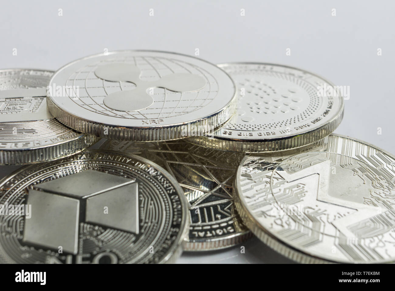 Blockchain cryptocurrency physical coins surrounded with variety of other crypto altcoins. Stock Photo