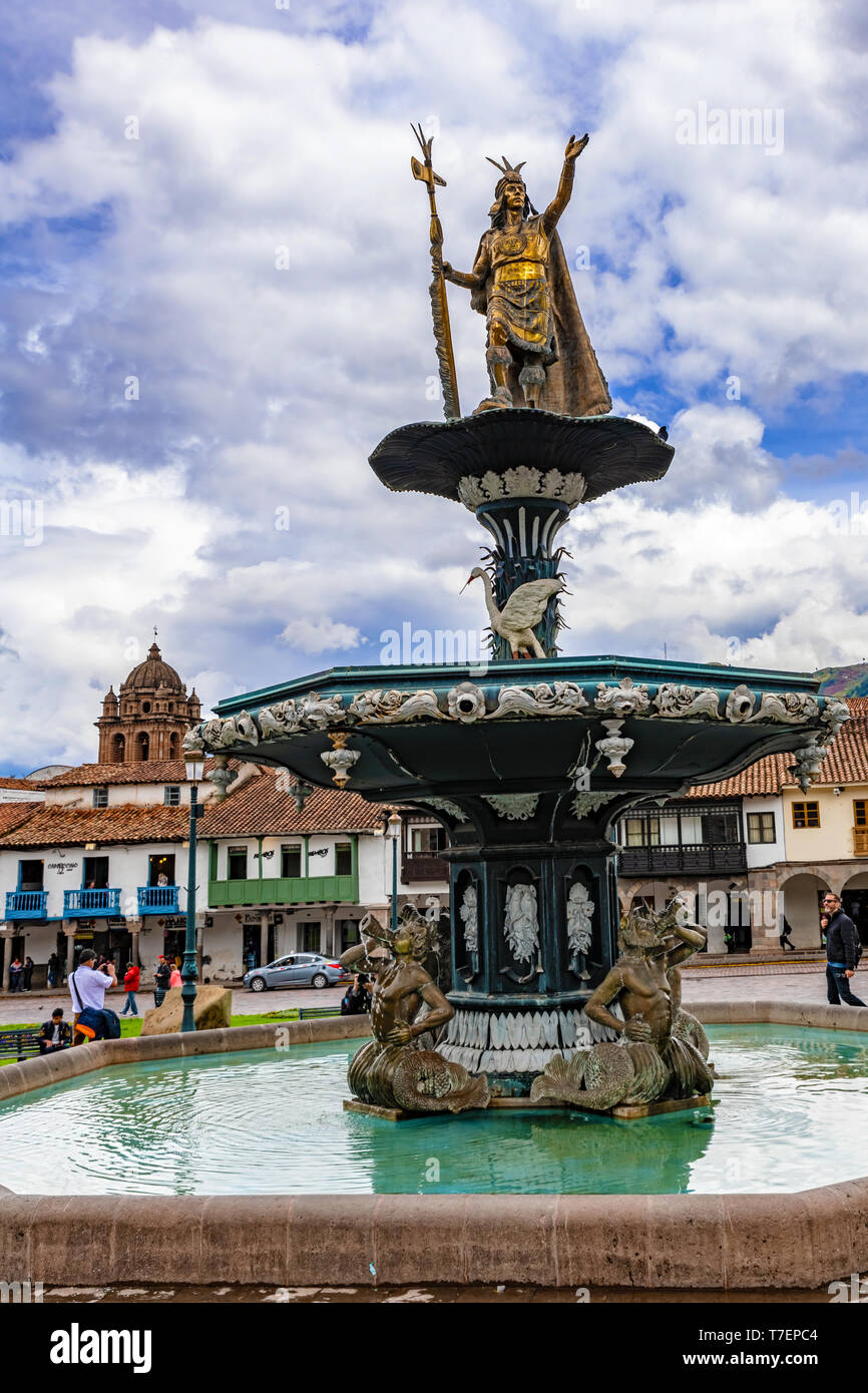 Cusco, Peru April 4, 2019 People visiting fountain statue of