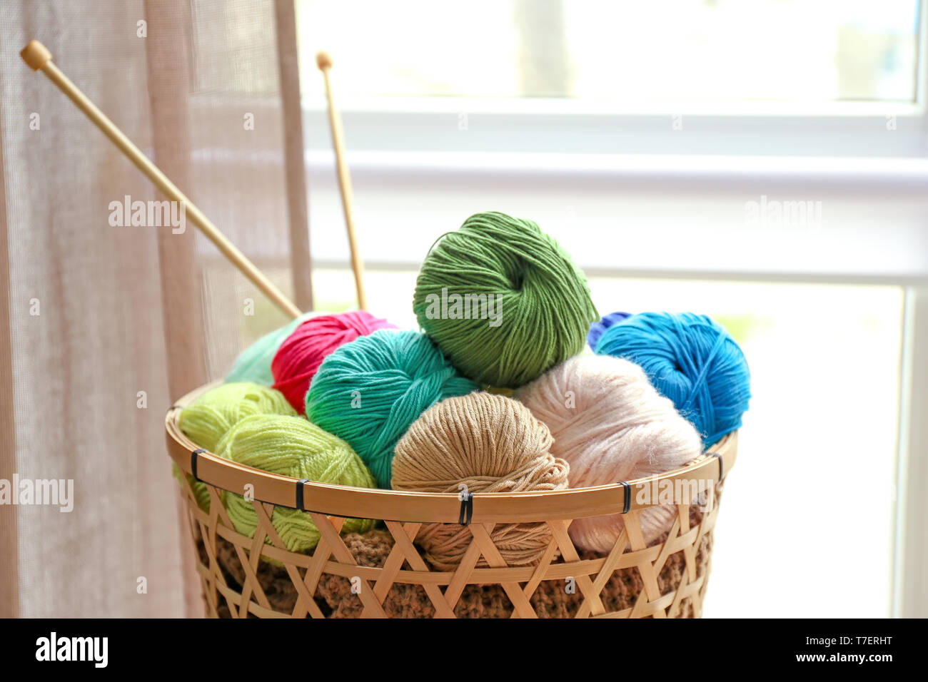 Colorful knitting yarn balls - wool and cotton thread in a wicker basket  Stock Photo - Alamy